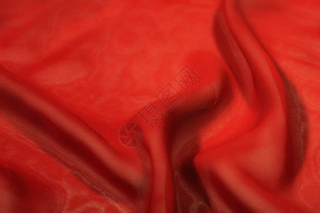 红色丝绸极端特写的纹理背景图片