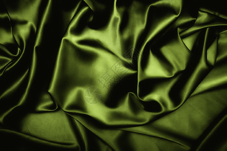 深绿色丝绸的质地背景图片