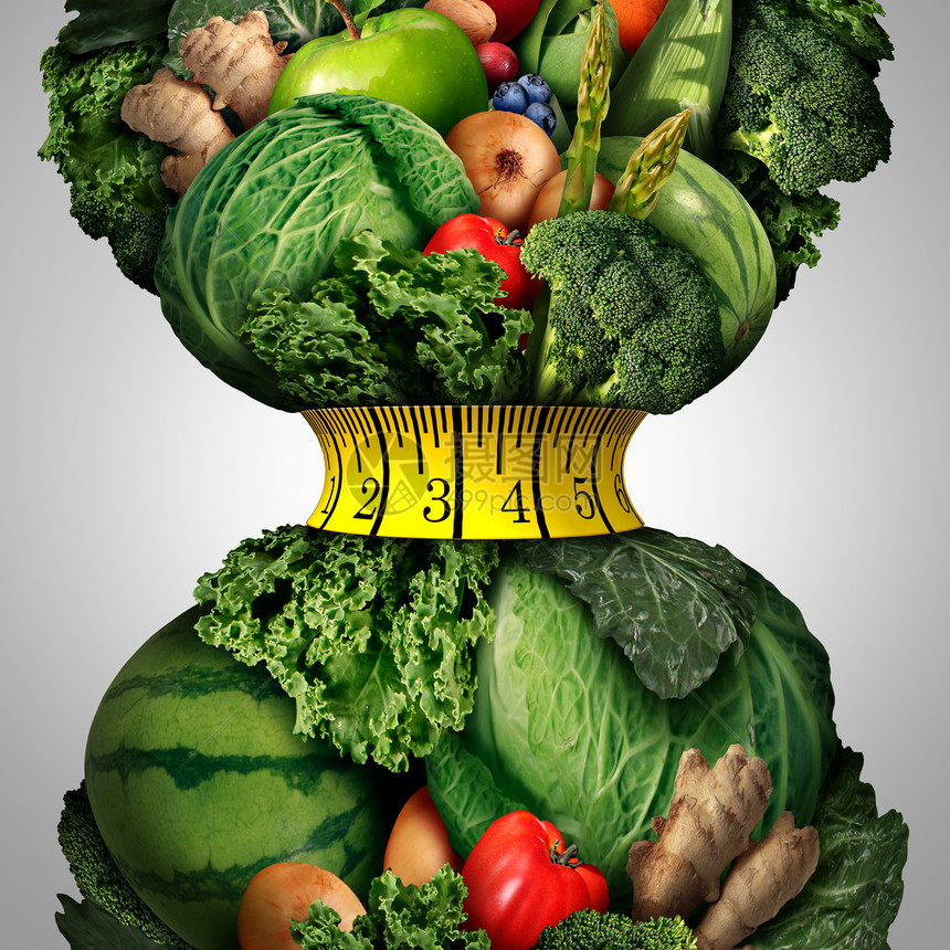 健康减肥饮食新鲜的水果蔬菜,用健身卷尺包裹紧缩的腰围形状上,健康生活方式减肥的隐喻图片