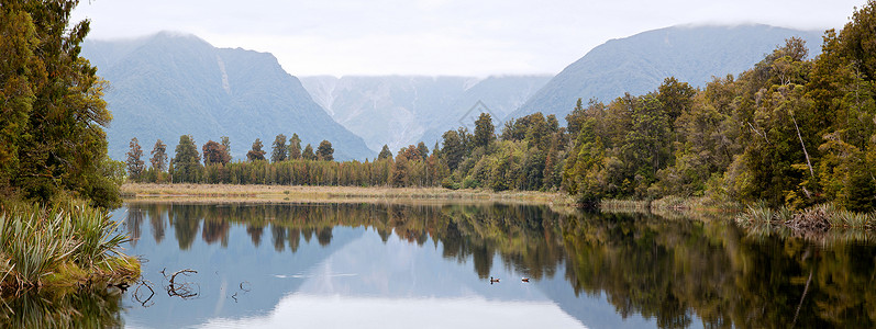 全景景观坐骑库克马西森湖与多云的天空新西兰背景图片