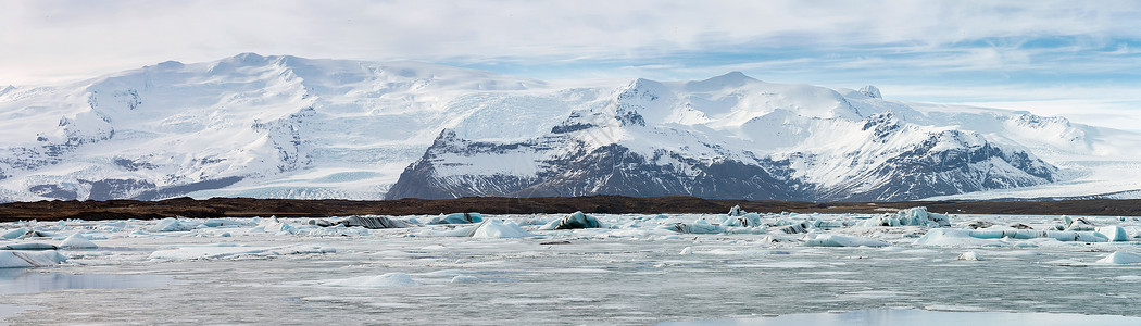 冰冻沙龙瓦纳霍科尔冰川全景Jokulsarlon泻湖冰岛背景