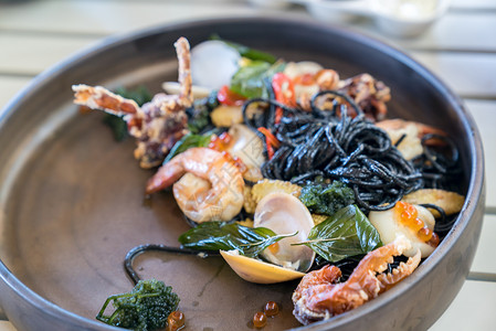 阿尔弗斯通地中海美食黑色海鲜意大利与贻贝平静虾螃蟹背景