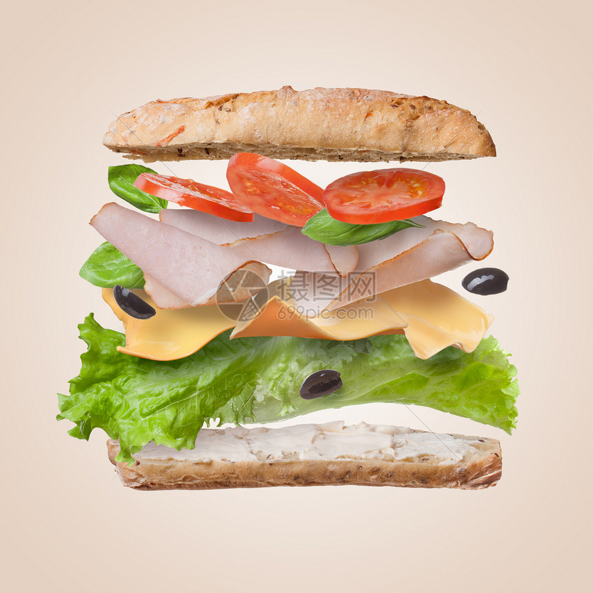 三明治与下降的成分空气中切片新鲜西红柿,火腿,奶酪生菜图片