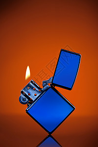产品火焰素材蓝色Zippo打火机橙色背景背景