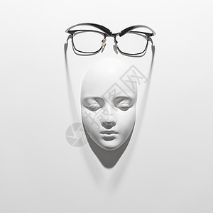 黑色框架的时尚眼镜白色背景上的石膏雕塑上阅读日常生活,柔的长阴影,放置文字平躺石膏罩,优雅的眼镜,白色背景图片