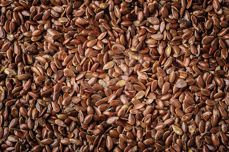 健康饮食机营养棕色亚麻籽亚麻籽天然食品背景图片
