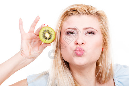 健康的饮食,新鲜的食物充满维生素女人着美味的绿色猕猴桃女人着绿色猕猴桃图片
