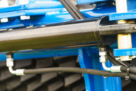 工业详细的气动液压机械蓝色机器特写上的钢泵偷蓝色机器的细节背景图片