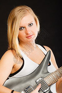 音乐,歌唱金发音乐天才的女人着黑色背景的电吉他金发女人着电吉他,黑色背景图片