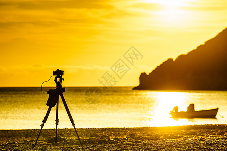 伯罗奔尼撒照片专业相机拍摄风景橙色日出日落海上,希腊佩罗蓬尼斯相机拍摄日出海上背景