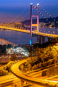 香港青衣地区青马桥地标悬索桥的日落及光照背景图片