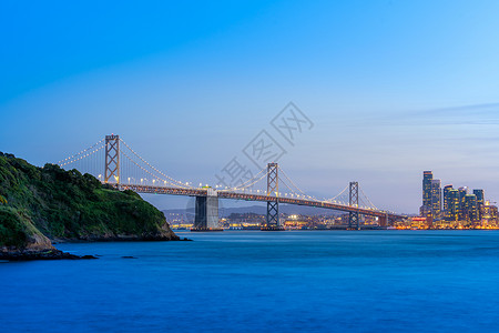 北加州湾桥和南弗朗西斯科湾风景的美丽日落太平洋西海岸南弗朗斯科州划时代旅行目的地城市景色概念背景