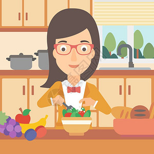 厨房一位妇女烹饪蔬菜沙拉图片