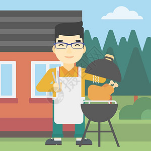 一个在后院烧烤架上做烤鸡的男人图片