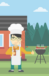烧烤架上做烤肉的男人图片