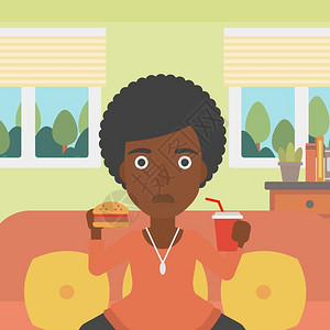 吃垃圾食品的非裔女子图片