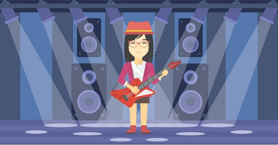 一名舞台上演奏电吉他的女人图片