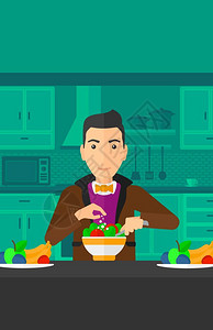 一个在厨房里做蔬菜沙拉的男子图片