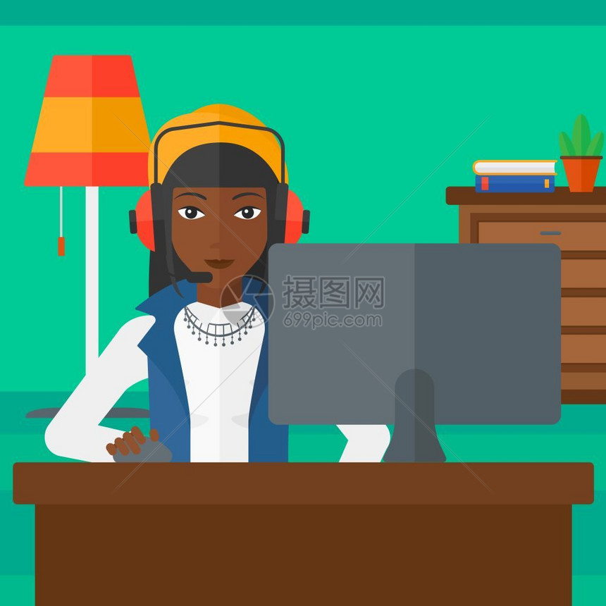 戴耳机坐在电脑前打游戏的非裔女孩图片