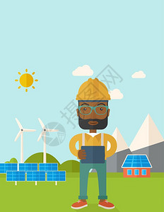 一位戴眼镜的非洲男人站在风力涡轮机前监测太阳能电池板的蓝图图片
