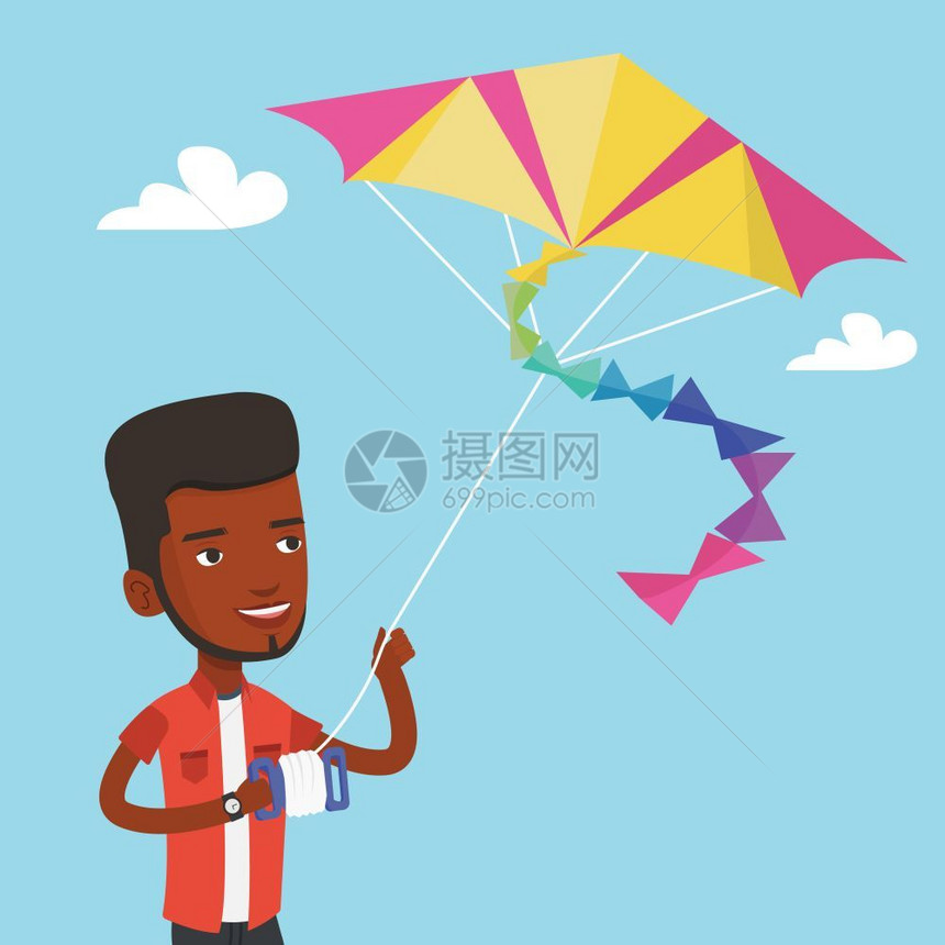 一名快乐的青年男子在户外放彩色风筝图片