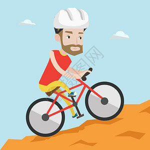 骑着自行车爬坡的年轻男性图片