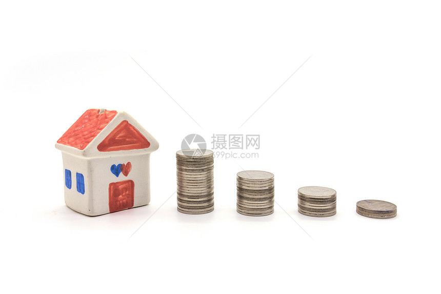 白背景上的房子和硬币图片