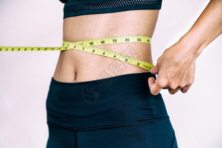 妇女体积微弱腰部和躯干测量图片