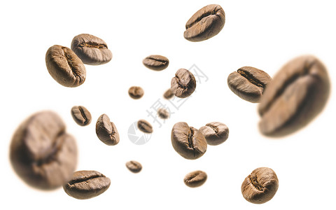 白背景中飘浮着的咖啡豆背景图片