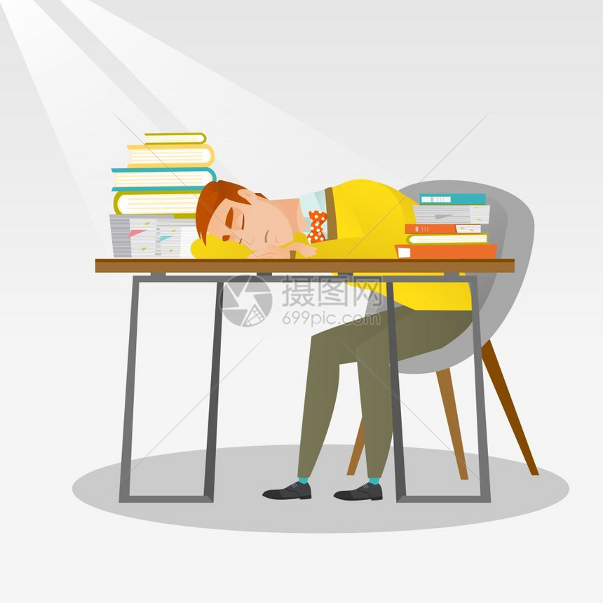 疲倦的学生睡在书桌上图片