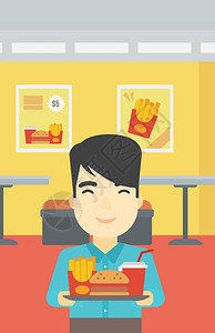 油腻食品一位亚裔年轻人在咖啡馆背景上拿着满盘垃圾食品在快餐厅里笑的男人在快餐厅吃午矢量平面设计图垂直布局插画