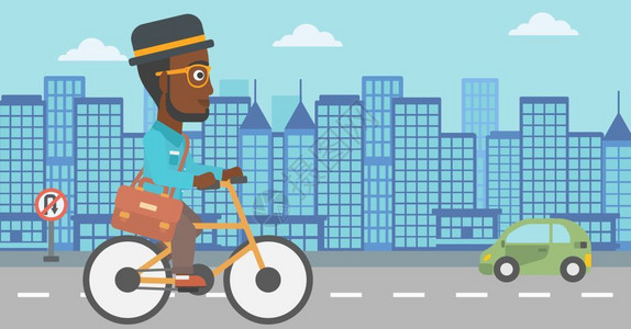 在城市中骑车的非裔男子图片