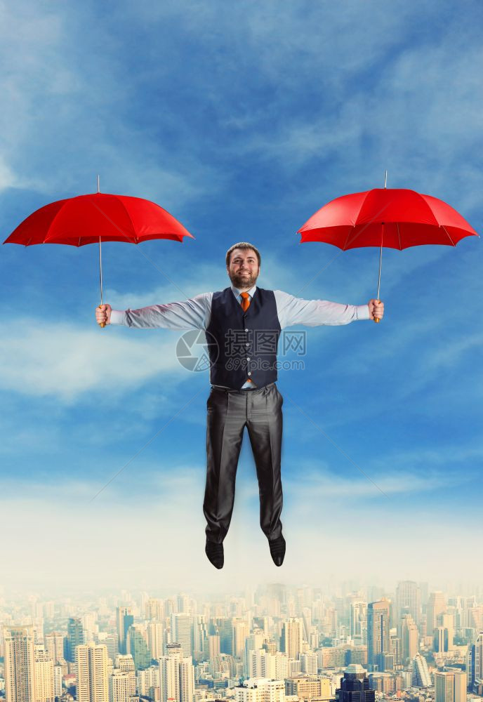 商人用两个红雨伞飞行商人用雨伞飞行图片