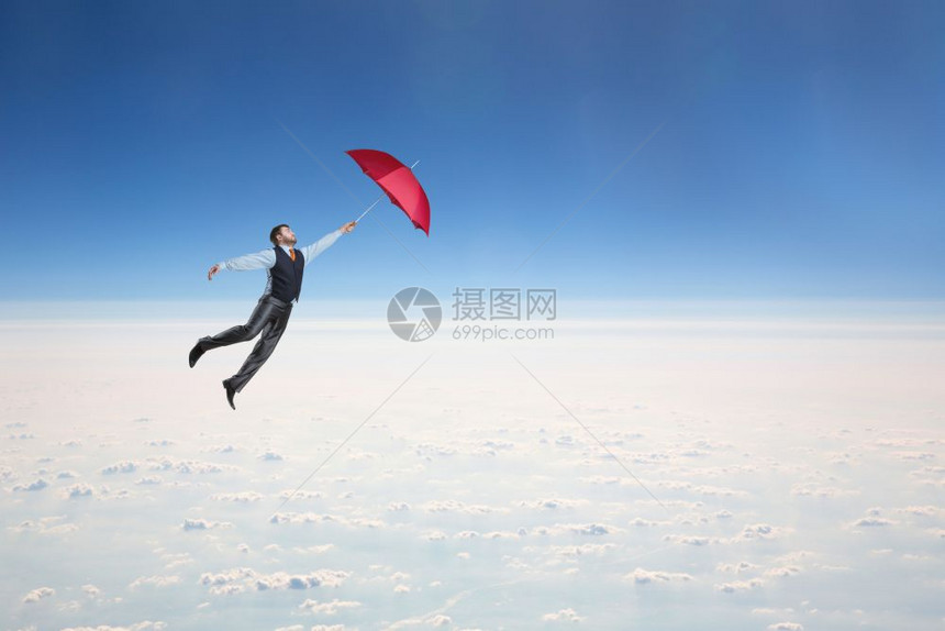男人用红伞在天空中飞男人用雨伞在天空中飞图片