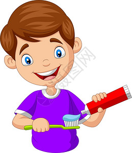 可爱的小男孩在牙刷上挤膏图片