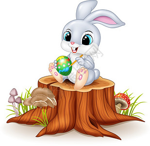 在树桩上画一个鸡蛋的兔子图片