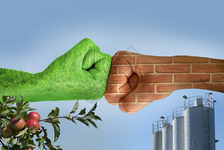 绿手与草和砖墙对抗环境与建筑工业对抗苹果树与图片