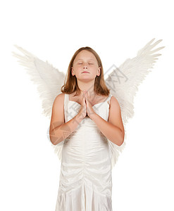 年轻的小天使女孩祈祷在白上与世隔绝图片