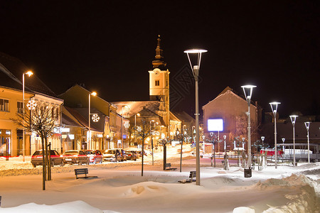 被雪装饰建筑圣诞节夜晚的街道背景