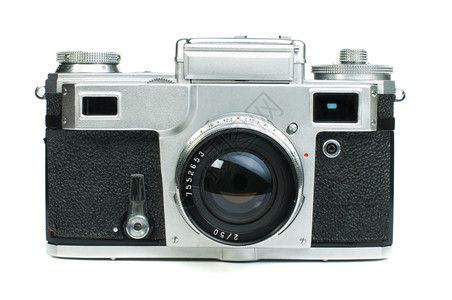 白色桌子上的古老旧相机背景图片