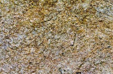 天然斑棕色黄和灰花岗岩石的纹理图片