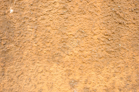 腐败变质混凝土墙壁上涂有棕色层混凝土墙上涂有被破坏的层背景