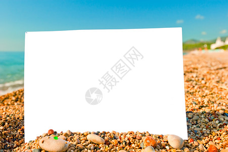 海滩上的白纸背景图片