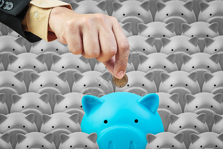 小猪银行和企业手储蓄金融概念图片