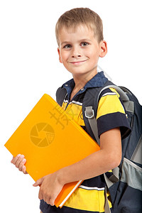 男孩在白背景中拥抱着书籍回到学校图片