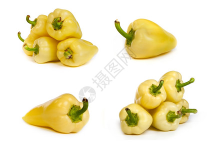 一组黄色的胡椒孤立在白的底幕上图片