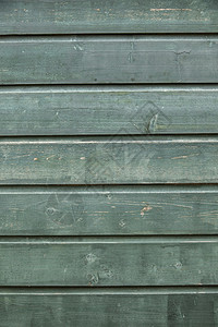 由部分风化蓝灰绿板构成的背景背景图片