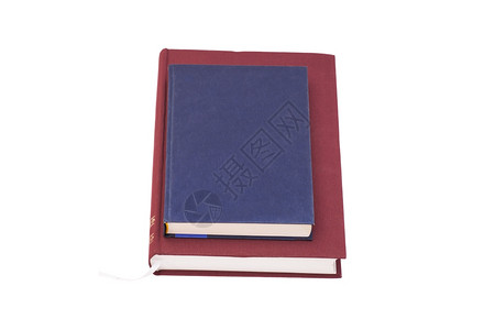 蓝色笔记本放在书上背景图片