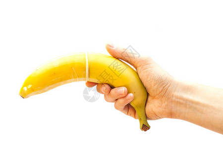 香蕉上套着避孕套背景图片
