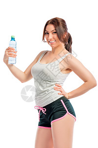 拥有一瓶纯水的快乐运动女员背景图片